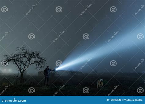 Man And Dog Searching With Flashlight In Outdoor Stock Photo Image Of