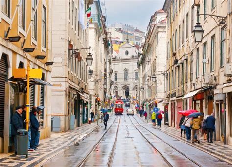 The Rainy Rua Da Conceicao With Riding Vintage Tram Lisbon Portugal Editorial Photo Image Of
