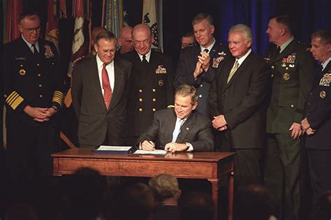 President George W Bush Proudly Signs Into Law A Defense
