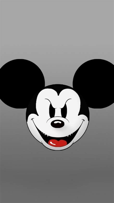 The Face Of Mickey Mouse On A Gray Background