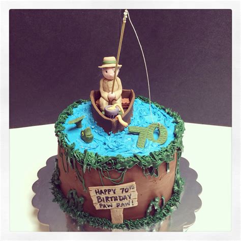 A Birthday Cake With A Fishing Theme On The Top And An Image Of A Man