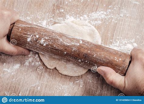 Male Cook Rolls Out Dough With Rolling Pin Stock Photo Image Of