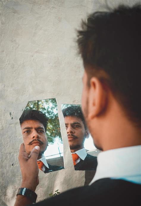 Man Looking In Broken Mirror 1259969 Stock Photo At Vecteezy