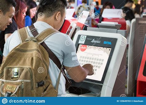 Now, how to check company registration malaysia and what is the process? KUALA LUMPUR, MALAYSIA, JUNE 18, 2018: Passenger Using ...