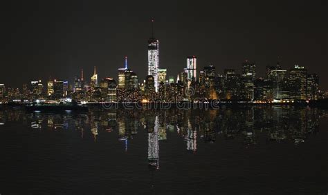 Manhattan At Night New York City Skyline With Reflection In Hudson