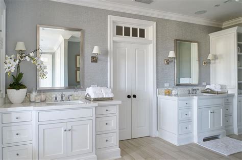 Picking the right bathroom vanity or bathroom cabinet can make or break a bathroom makeover or renovation. His and her vanities in a large master bathroom. White ...