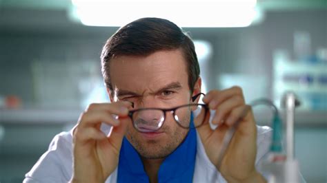 Doctor Looking Through Glasses Close Up Of Researcher Squints Eyes