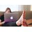 Laptop & Feet Royalty Free Stock Photo And Image