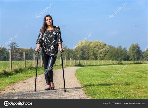 Disabled Woman Walks On Crutches In Nature — Stock Photo
