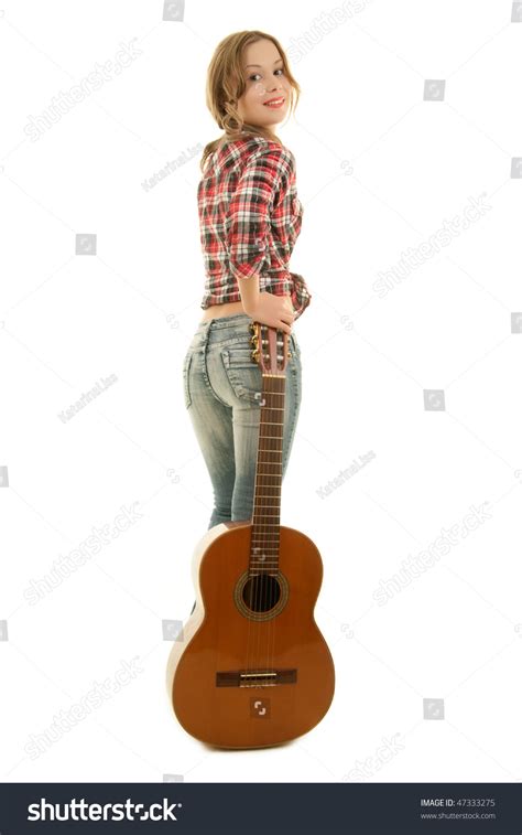Young Girl Holding Guitar And Looking Back Stock Photo 47333275