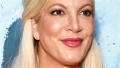 the sad reason tori spelling decided to get her breast implants redone