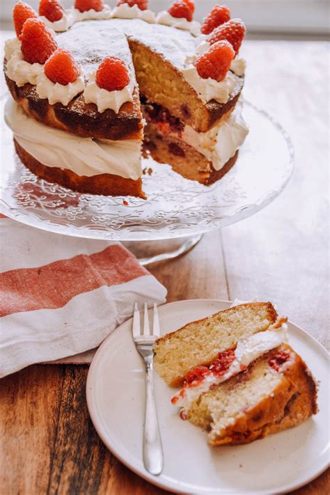 John whaite shares his recipe for a light, fruity layer cake with chocolate ganache and simple sponge. White Chocolate & Raspberry Cake
