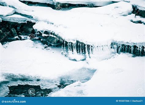 A Beautiful Ice Formations Along The Frozen River In Winter Stock Photo