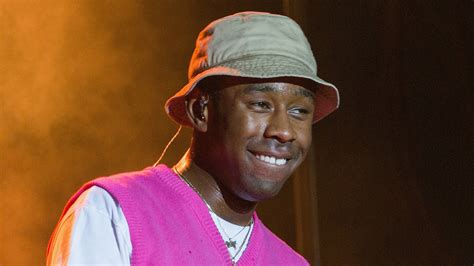 Smiling Tyler The Creator Is Wearing Purple White Dress And Cap Hd