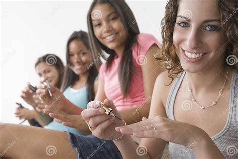 teen girls applying nailpolish stock image image of cosmetics background 10621089