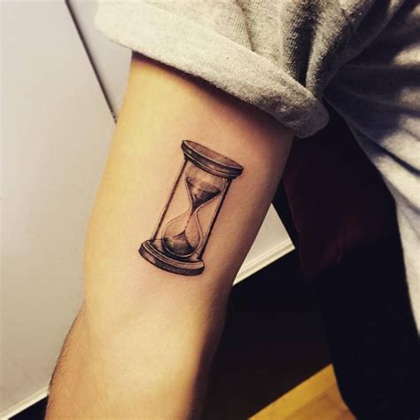 Fine Line Hourglass Tattoo On The Right Inner Arm