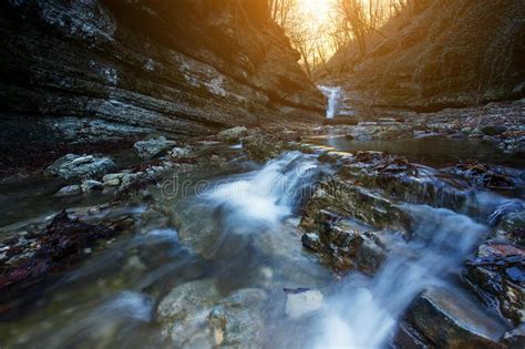 Waterfall At Mountain River In Autumn Forest At Sunset Stock Image