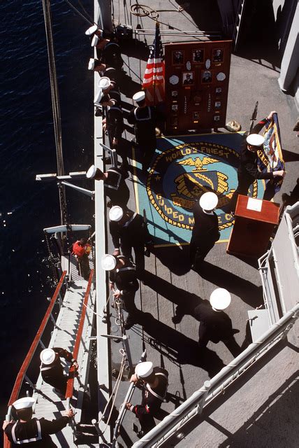 Sailors Stand At The Railing On The Quarterdeck Of The Guided Missile