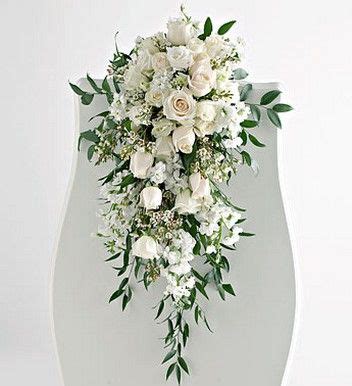 You might want to carry a snack, like these marshmallow pops. Cascading Flower Bouquets | ... of Wedding Pew Arrangement ...