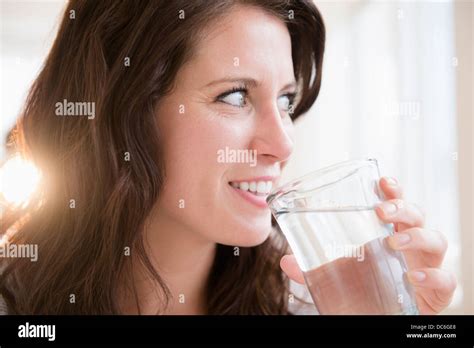 Portrait Of Young Woman Holding Glass Of Water Stock Photo Alamy