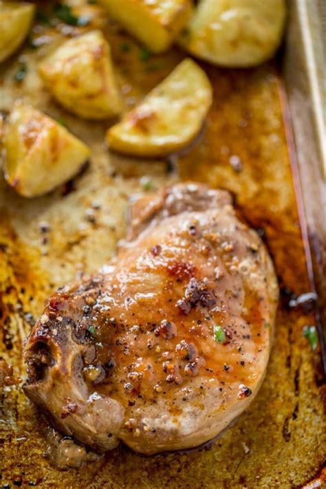 Oven Baked Pork Chops Covered In Brown Sugar And Garlic On
