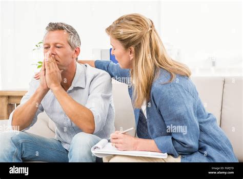 Concerned Therapist Comforting Male Patient Stock Photo Alamy