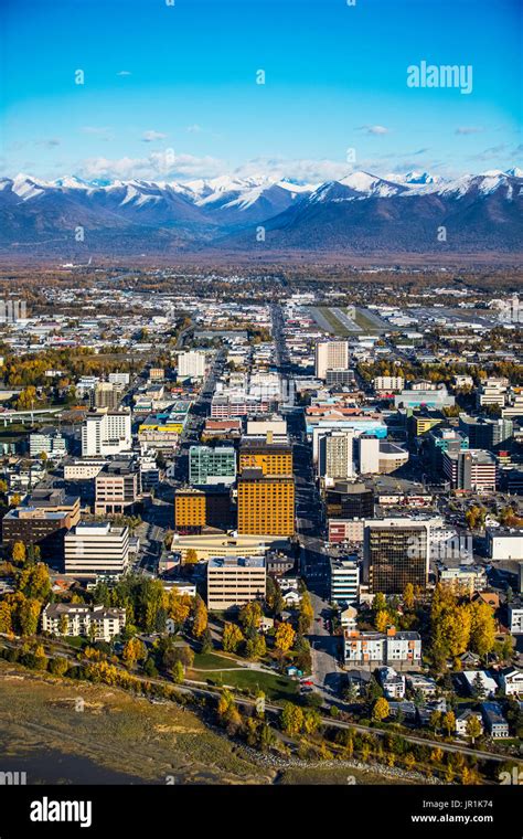 Aerial View Of Downtown Anchorage And Chugach Mountains During Autumn