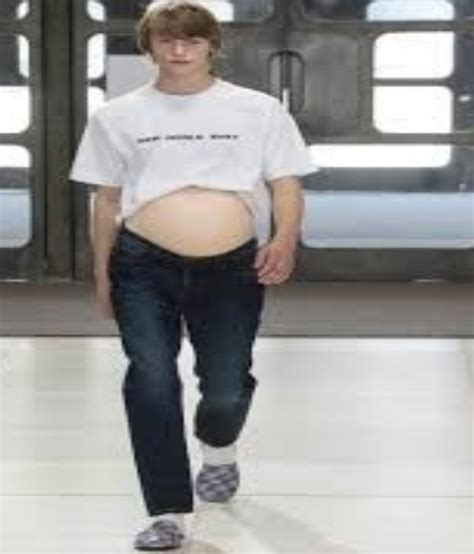 men with fake pregnancy bellies walk the ramp in london