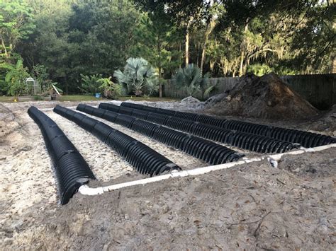 The membrane prevents soil or dirt from slipping between the crushed stones and blocking the leaching bed. Drain Field Repair Services In Tampa | Tampa Bay Plumbers