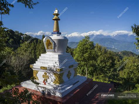 Decorative Buddhist Monument On A Mountainside With A View Of The