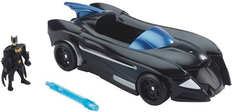 Batman Action Figure Next To Batmobile Toy