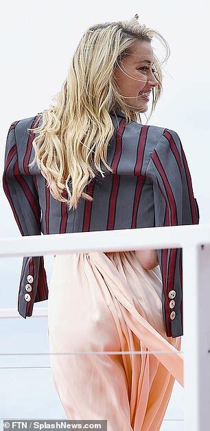 Amber Heard Goes Braless In Very Daring Plunging Dress As She Steps Out