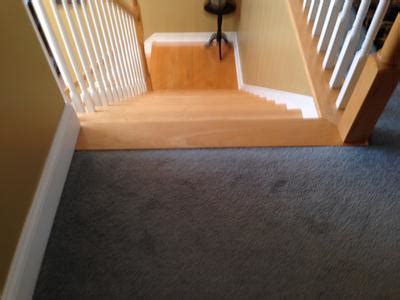 I just looked at mine and i believe you do need a transition piece. Laminate Floor on landing at top of stairs - transition