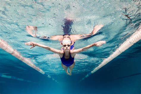 Underwater Picture Of Female Swimmer In Swimming Suit And Goggles