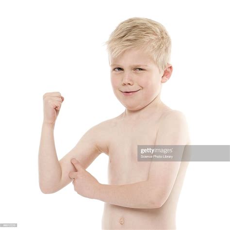 Boy Flexing His Biceps High Res Stock Photo Getty Images