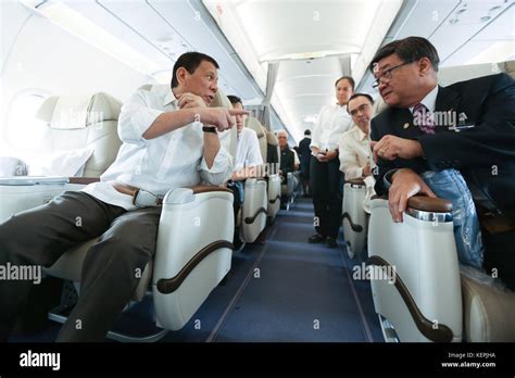 Rodrigo Duterte Chats With Justice Secretary Vitaliano Aguirre Ii While On Board Philippine