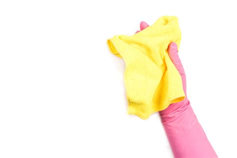 Dishwashing Gloves And Yellow Cleaning Rag Isolated On White Background