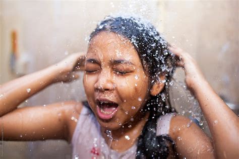 A Girl Enjoy Shower Bath In Summertime India By Stocksy Contributor