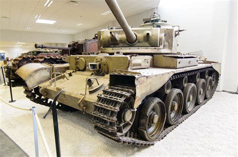An Old Tank Is On Display In A Museum