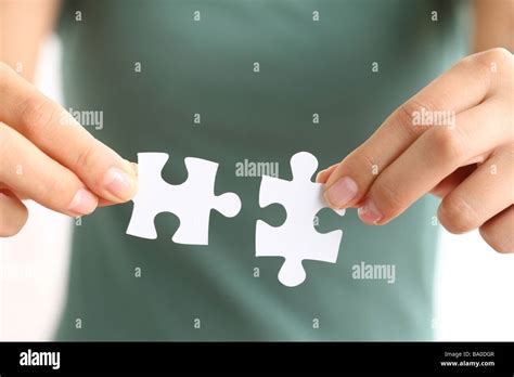 Hands Holding Two Matching Puzzle Pieces Stock Photo Alamy