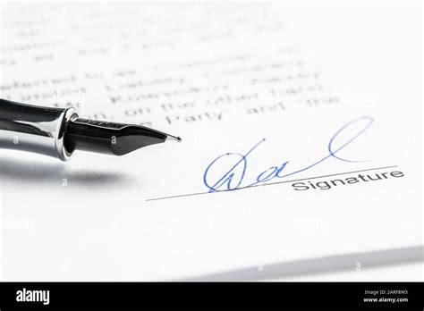 Signature In Ink In The Contract Sheet Of Paper And Pen Close Up Stock
