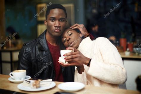 Dark Skinned Couple Sitting In Coffee Shop Stock Photo By ©gaudilab