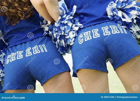 Rear View Midsection Of Cheerleaders With Pom Poms Royalty Free Stock