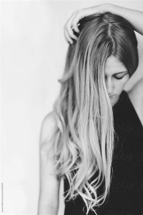 Girl With Long Hair Partially Covering Her Face By Stocksy