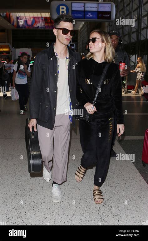 Brie Larson and her fiancé Alex Greenwald depart from Los Angeles