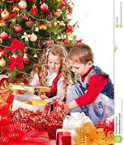No two are alike, so you need an uncommon variety of gift ideas for all the special kids in your life. Children With Gift Box Near Christmas Tree. Stock Photo ...