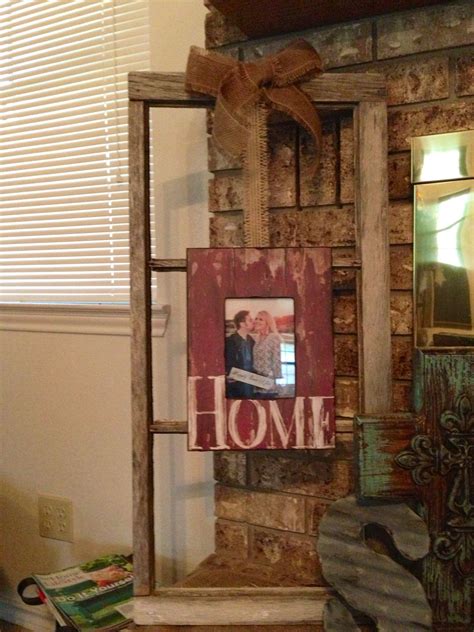 This post may contain affiliate as my decorating style has evolved my hubby and i love to repurpose things we find on the side the first step is deciding on which photo to use, how to have it printed inexpensively and then. Old window frame with new picture tied with burlap. | Old ...