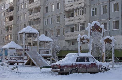 A Car Covered In Ice Is Pictured Near A Playground In Yakutsk Metro Uk