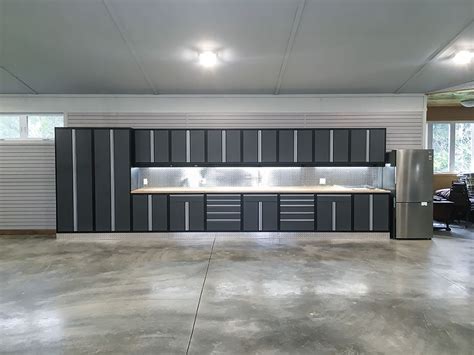 Modern house designs discard the idea of an attached garage near a stunning outhouse design. Garage Makeover Ideas | Garage Living