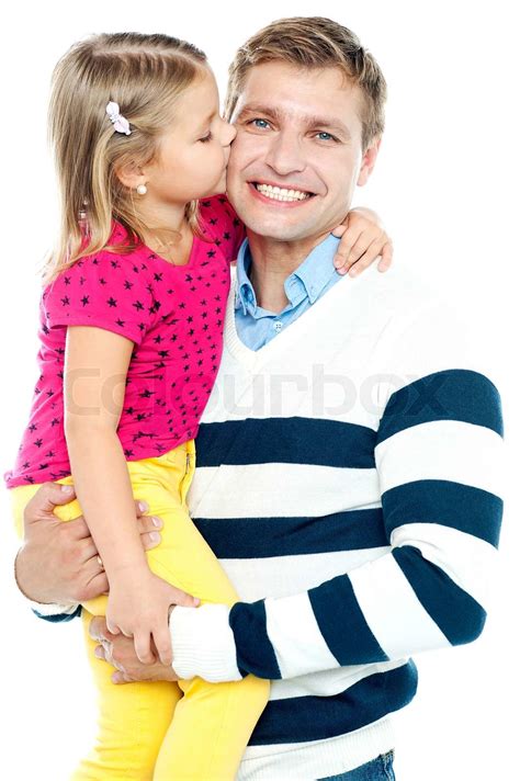 Sweet Daughter Kissing Her Smiling Father While He Holds Her In His Arms Stock Image Colourbox